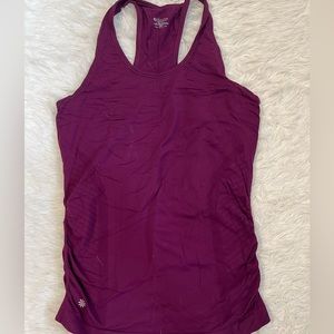 Size S Athleta tank top. Purple. waist grips. No holes or stains